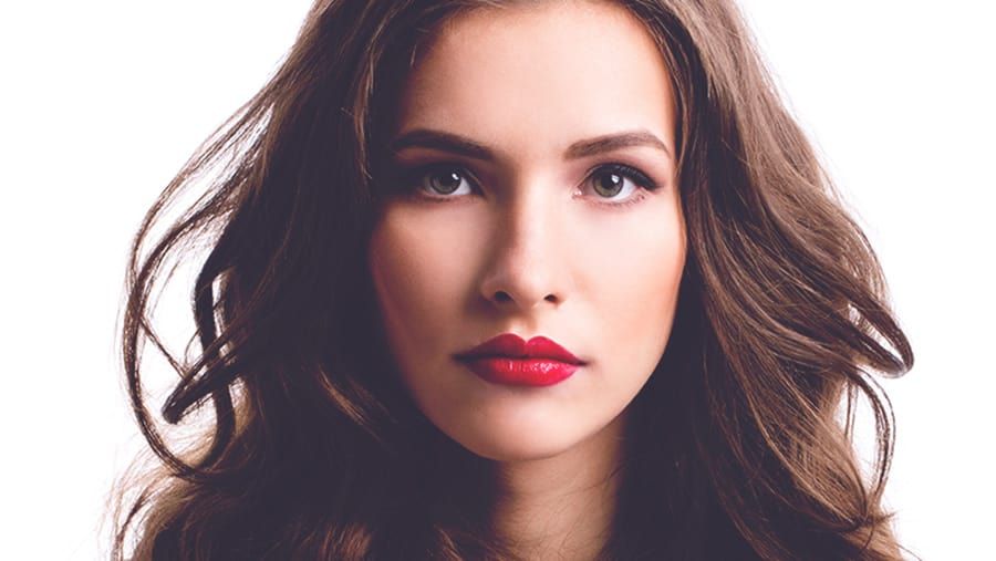 Close up portrait of woman's face with red lipstick