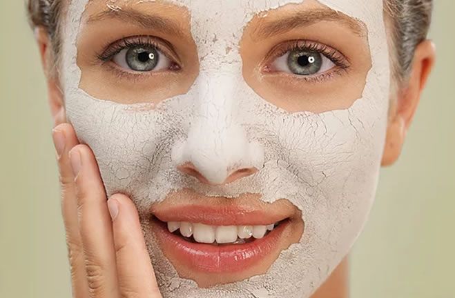 Close up portrait of woman's face with a face mask treatment on
