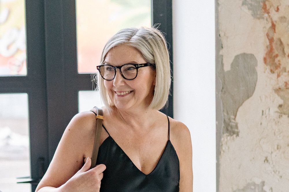 older woman in a black dress