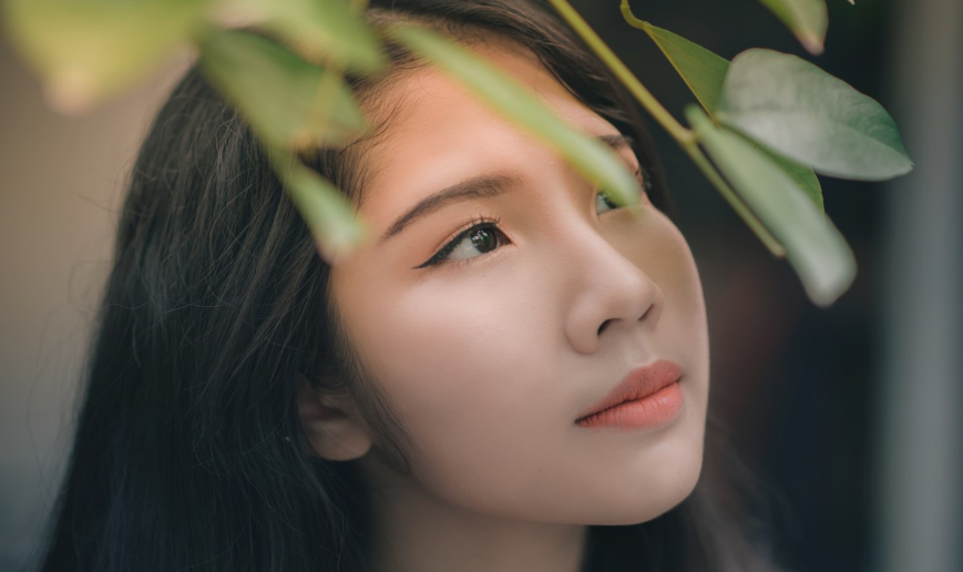 woman with smooth skin looking content