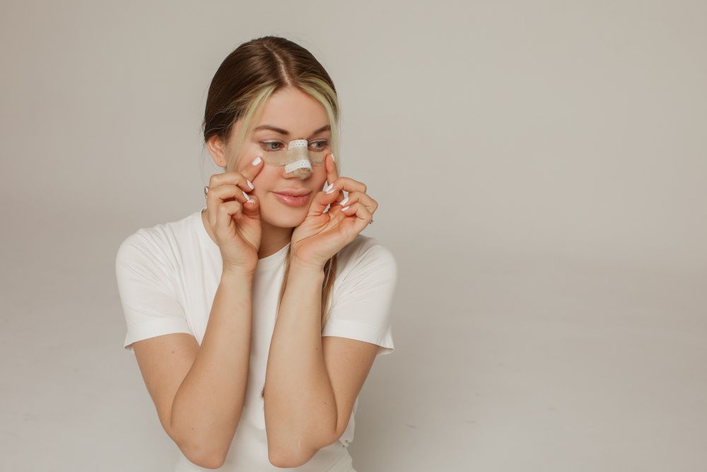 woman with bandaged nose
