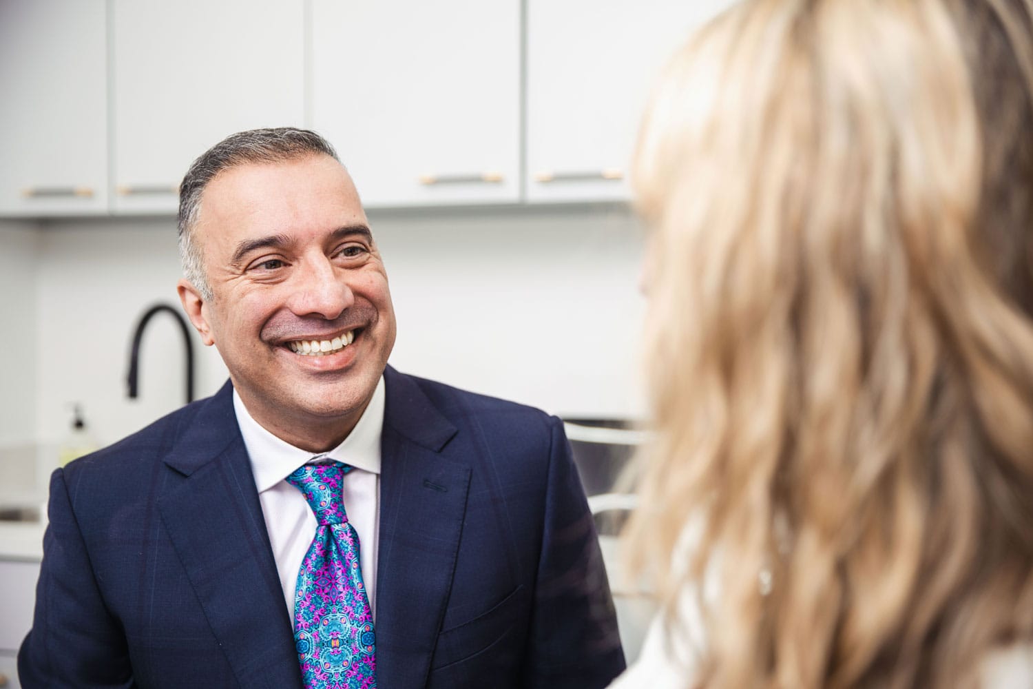 dr-athre-smiling-at-patient